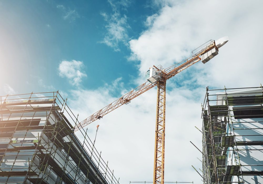 Shot of a crane and building at a construction site.